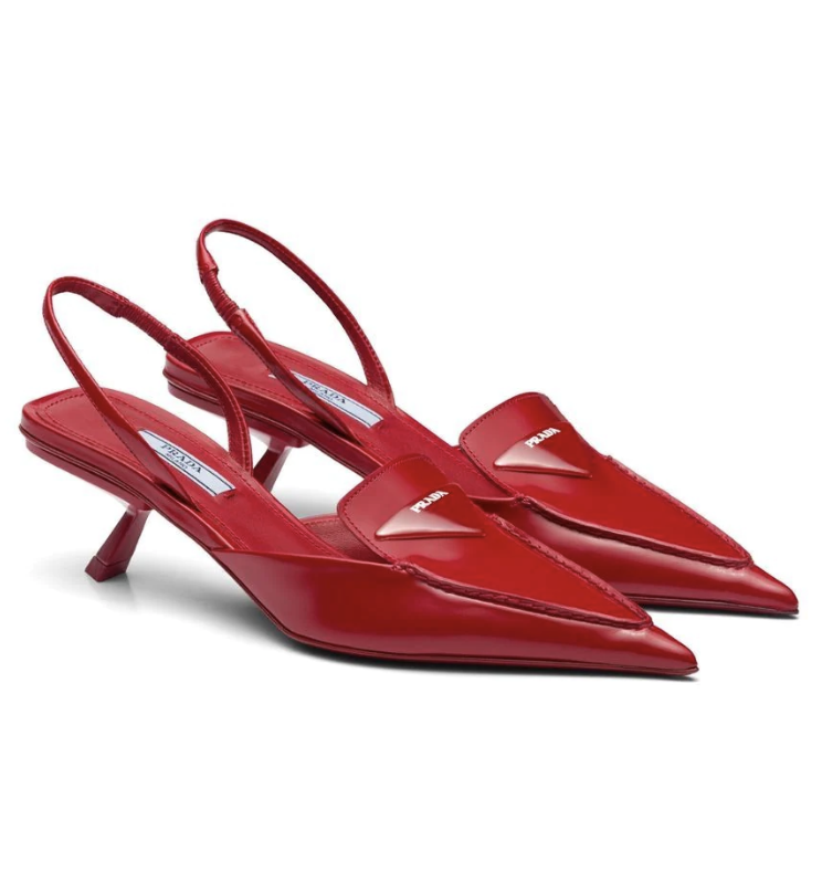 Revisiting a design from Prada's extensive archives, these slingback pumps are reminiscent of '90s style with their pointed toe. Crafted from brushed leather, the bright-red design is set on the brand's signature comma heel.