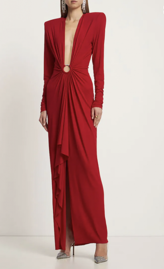 Red dress from Alexandre Vauthier with a super deep neckline and a draped front slit. Red clothing is one of the key fashion trends this winter.
